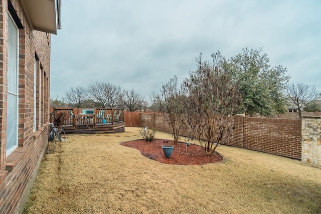 view of yard with a wooden deck