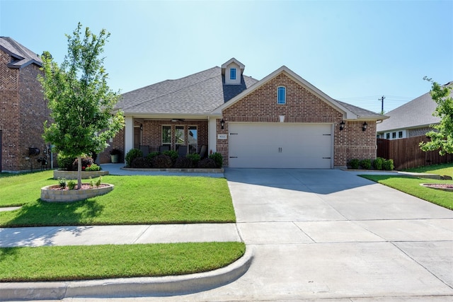 view of front of home featuring a garage and a front yard