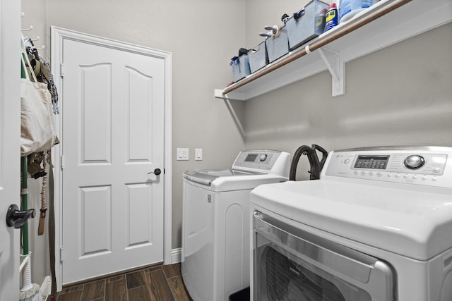 clothes washing area with washer and clothes dryer