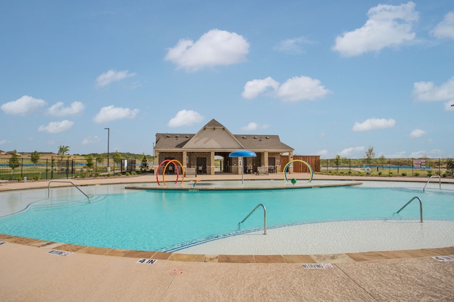 view of swimming pool featuring a patio