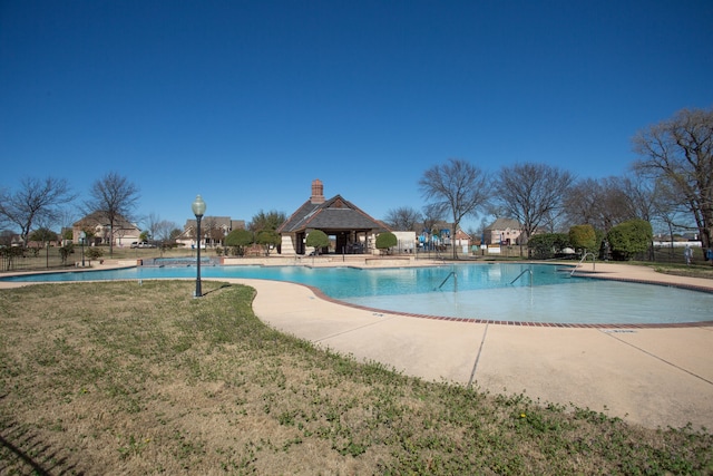 view of swimming pool featuring a patio area