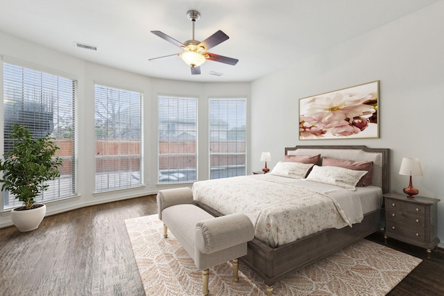 bedroom featuring dark hardwood / wood-style flooring and ceiling fan