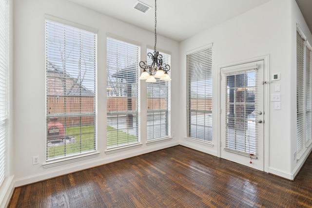 900 Thimbleberry Dr, Mckinney, TX 75071 - unfurnished dining area featuring an inviting chandelier, visible vents, dark wood-style floors, and baseboards