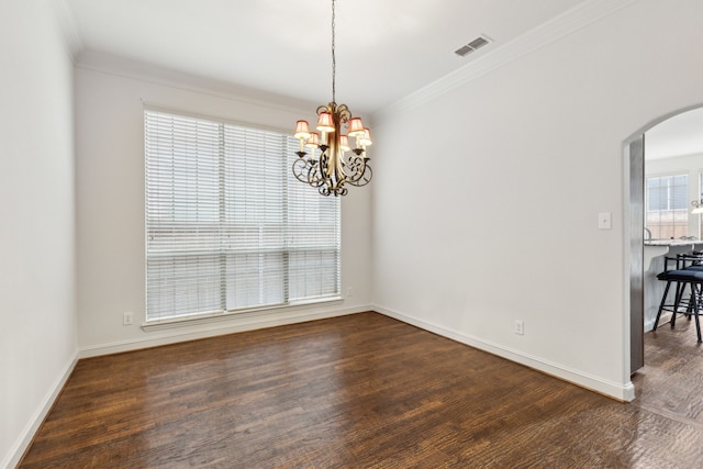 900 Thimbleberry Dr, Mckinney, TX 75071 - unfurnished dining area featuring an inviting chandelier, visible vents, ornamental molding, arched walkways, and wood finished floors