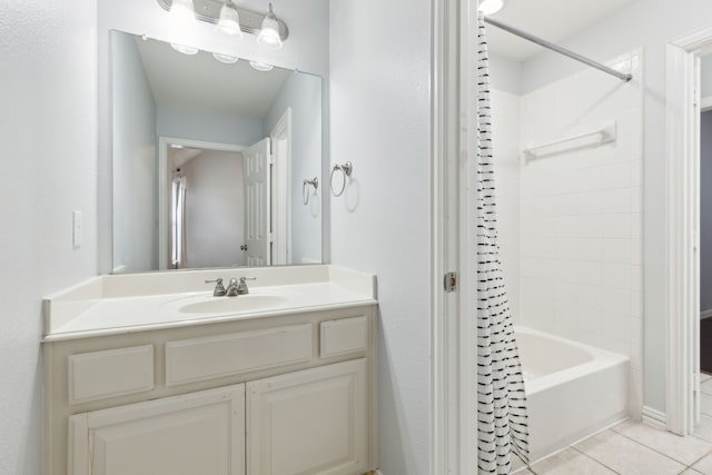 bathroom with shower / tub combo with curtain, vanity, and tile patterned floors