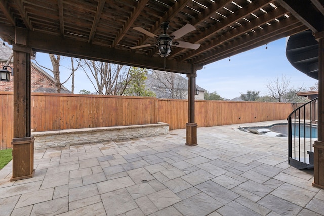 view of patio with ceiling fan, a pergola, and a fenced in pool