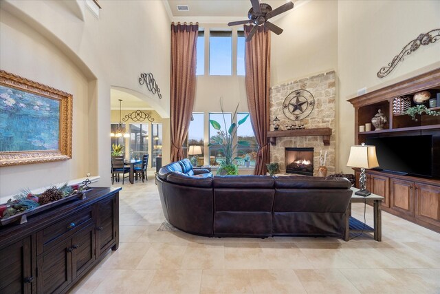 kitchen with stainless steel appliances, light stone counters, tasteful backsplash, ornamental molding, and custom range hood