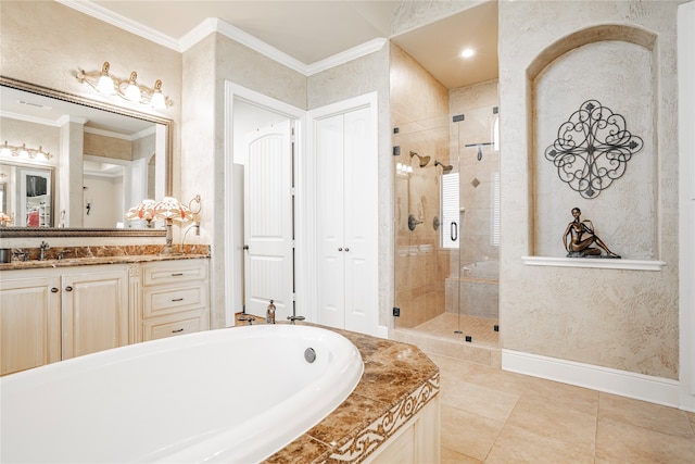 bathroom featuring tile patterned flooring, crown molding, separate shower and tub, and vanity