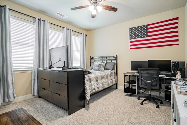 carpeted bedroom with ceiling fan