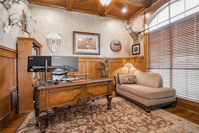 office with coffered ceiling, ceiling fan, beam ceiling, and hardwood / wood-style flooring