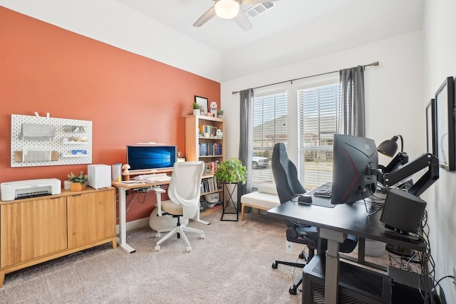 carpeted office featuring ceiling fan