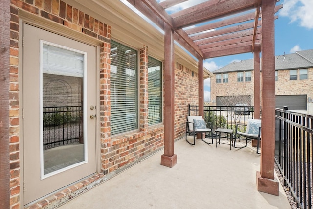 balcony featuring a pergola