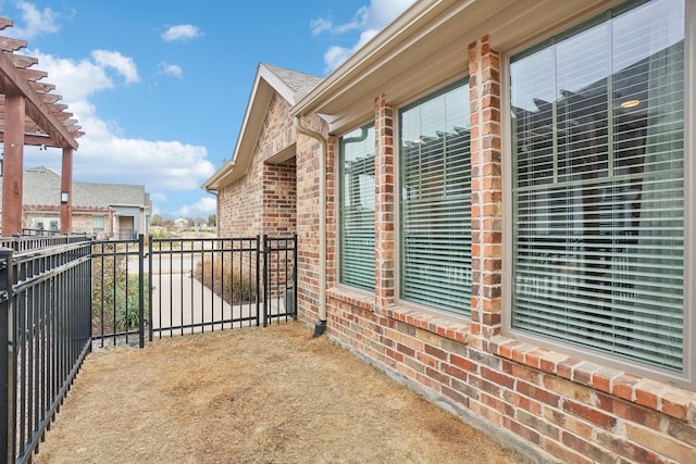 view of property exterior featuring a pergola