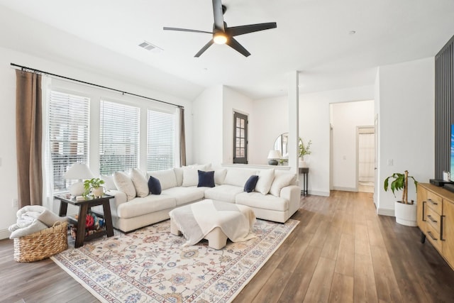 living room featuring hardwood / wood-style flooring and ceiling fan