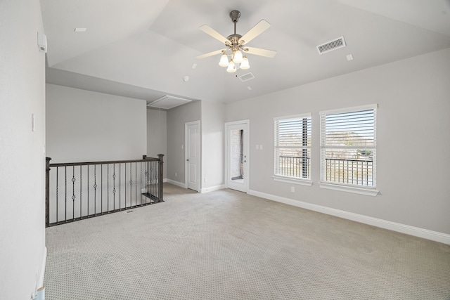 carpeted empty room featuring lofted ceiling and ceiling fan