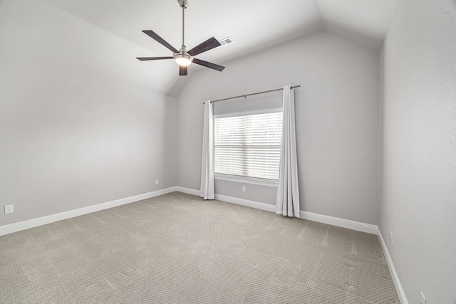 carpeted empty room with lofted ceiling and ceiling fan