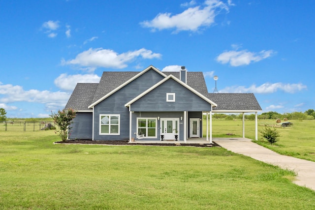 back of property featuring a lawn