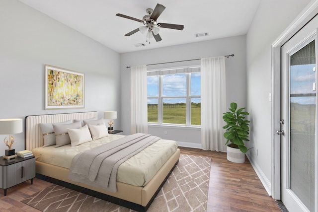 bedroom featuring dark hardwood / wood-style floors and ceiling fan