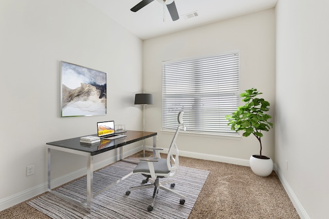 carpeted home office with ceiling fan