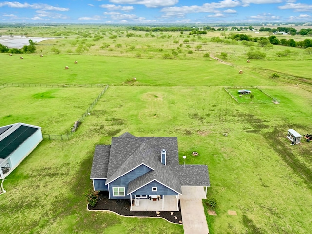 birds eye view of property featuring a rural view