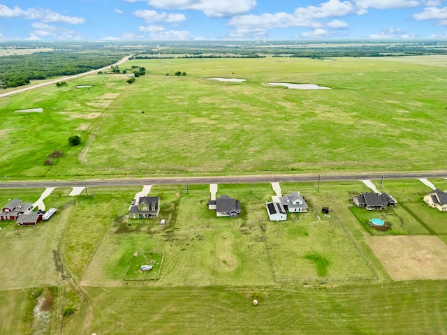 birds eye view of property featuring a rural view