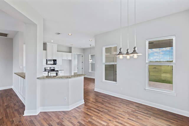 kitchen featuring light stone countertops, white cabinets, decorative light fixtures, stainless steel range with electric cooktop, and kitchen peninsula