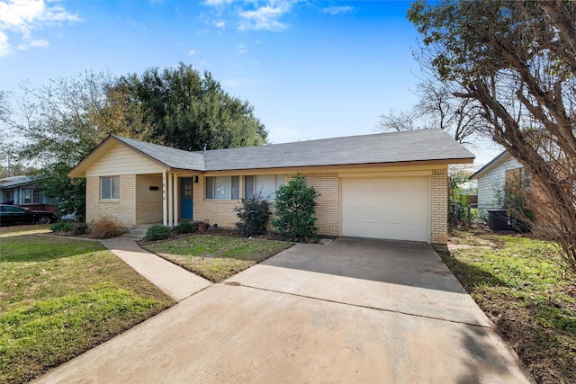 single story home with a garage and a front yard