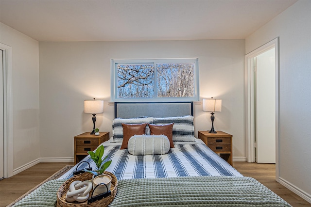 bedroom with hardwood / wood-style flooring