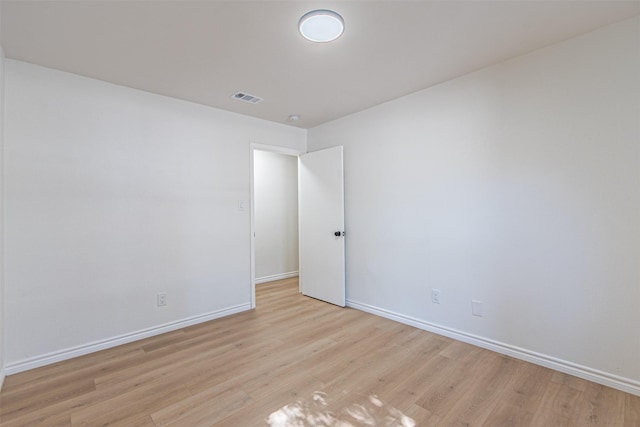 spare room featuring light wood-type flooring