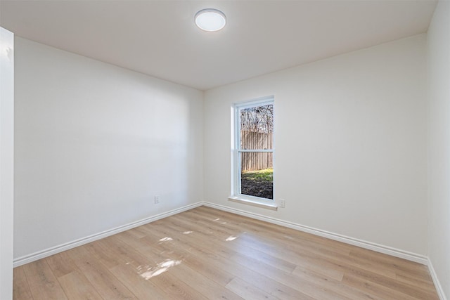 spare room featuring light wood-type flooring