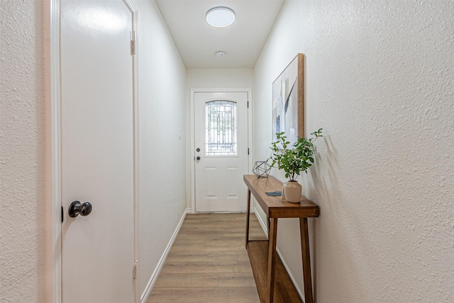 entryway with light hardwood / wood-style floors