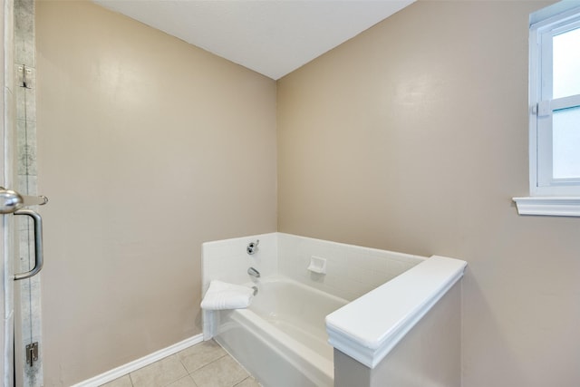 bathroom featuring tile patterned flooring and a bathing tub