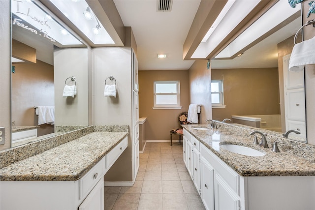 bathroom featuring vanity and tile patterned flooring