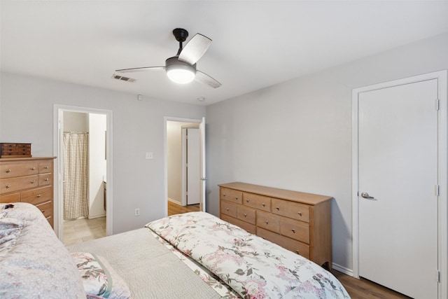 bedroom featuring ceiling fan and ensuite bathroom