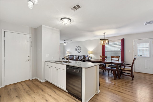 kitchen featuring decorative light fixtures, white cabinetry, black dishwasher, sink, and light hardwood / wood-style floors