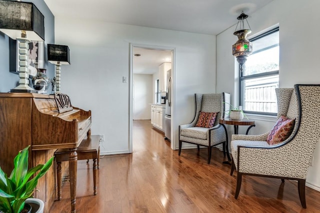 sitting room featuring light hardwood / wood-style flooring