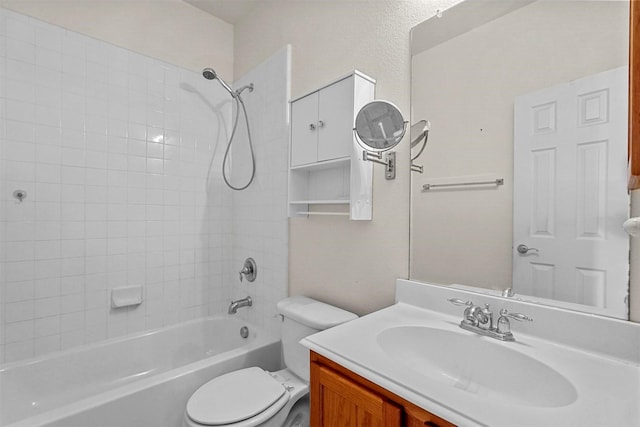 full bathroom with vanity, toilet, and tiled shower / bath combo