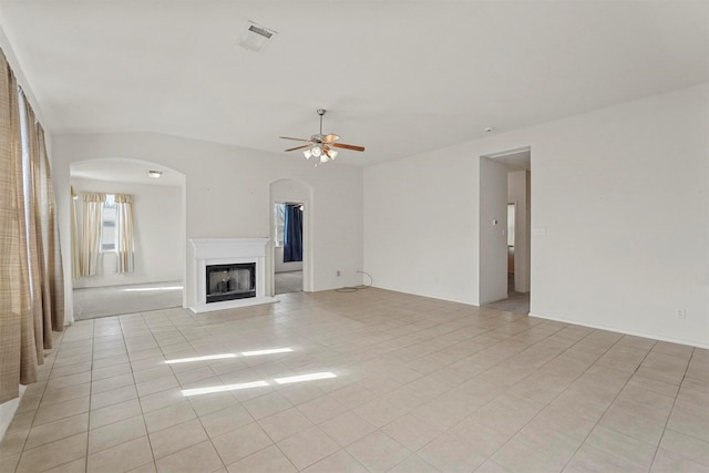 unfurnished living room with ceiling fan and light tile patterned floors