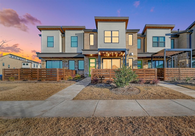 751 Mountain Laurel Dr, Prosper, TX 75078 - view of front of house featuring a fenced front yard and stone siding