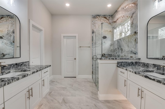 bathroom with vanity and an enclosed shower