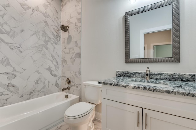 full bathroom with vanity, tiled shower / bath combo, and toilet