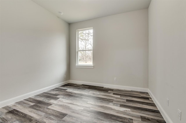 spare room with hardwood / wood-style floors