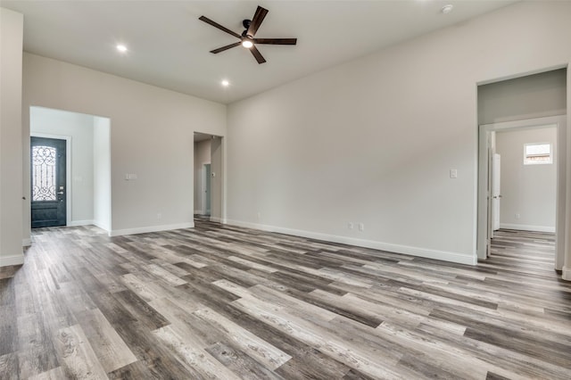 spare room featuring ceiling fan and light hardwood / wood-style flooring