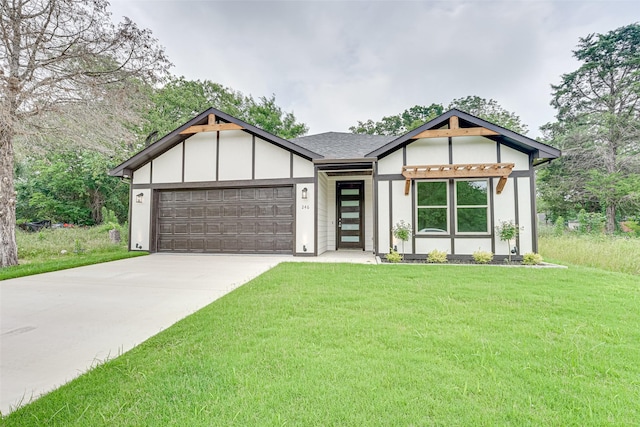 view of front facade with a garage and a front lawn