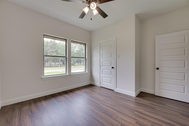 unfurnished bedroom with ceiling fan and dark hardwood / wood-style floors