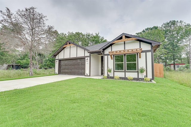 view of front of house with a garage and a front yard