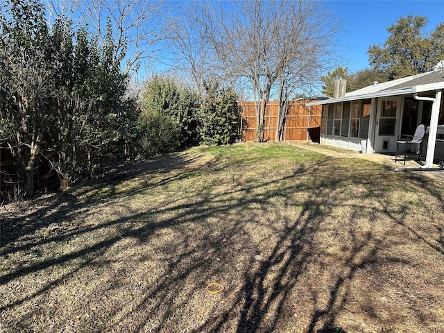 view of yard with a sunroom