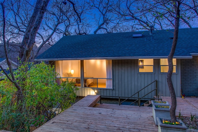 rear view of house with a wooden deck