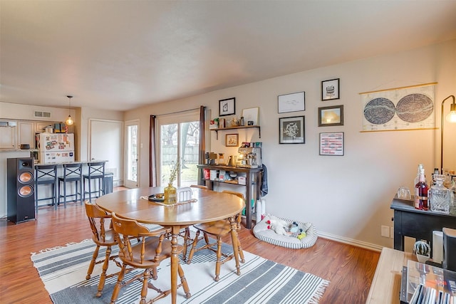 dining area featuring hardwood / wood-style flooring