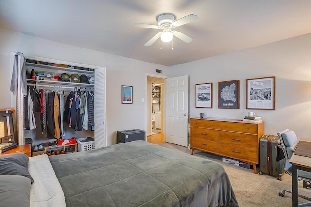 bedroom featuring light colored carpet, a closet, and ceiling fan